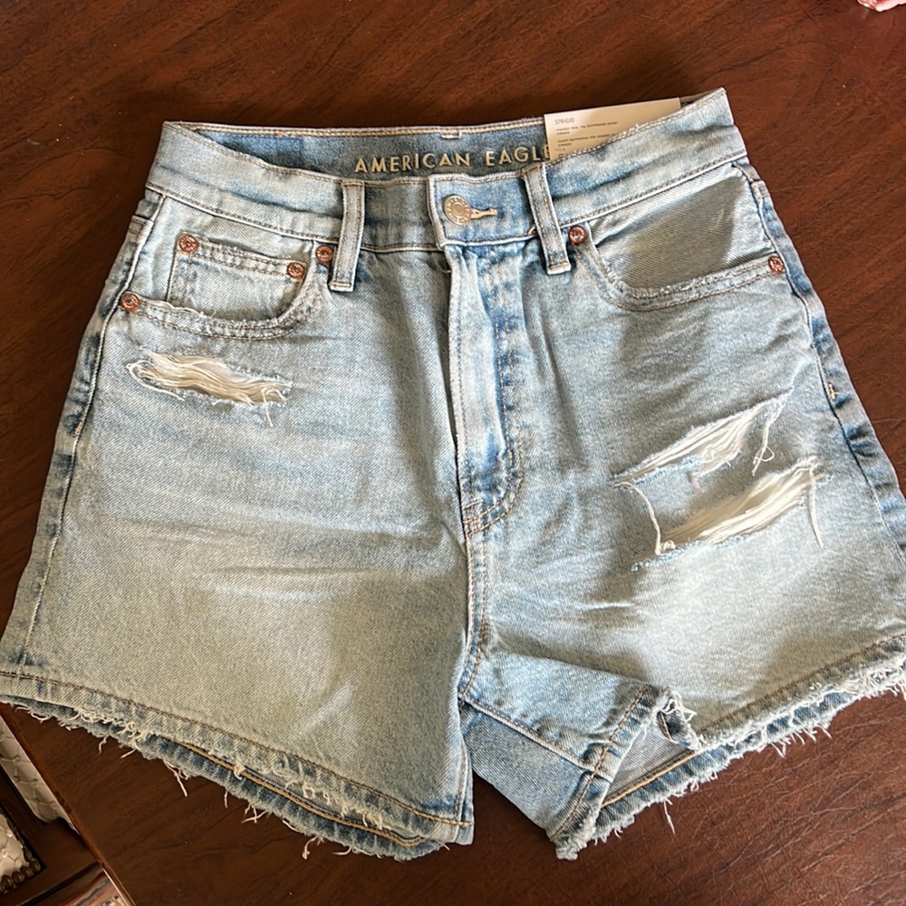 New American Eagle distressed light denim shirt. Size 0 (25W)